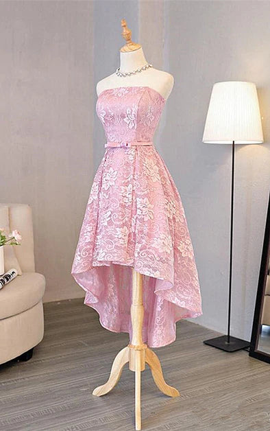 Close-up of the lace detail on a pink A-line dress.