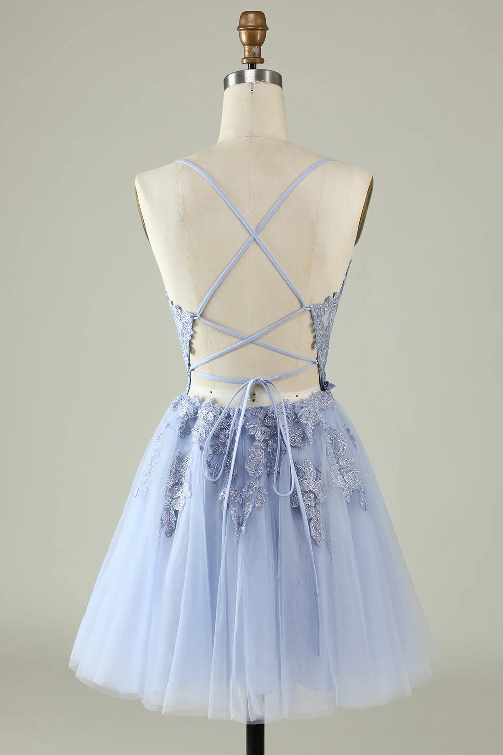 Back view of an A-line spaghetti strap formal dress.