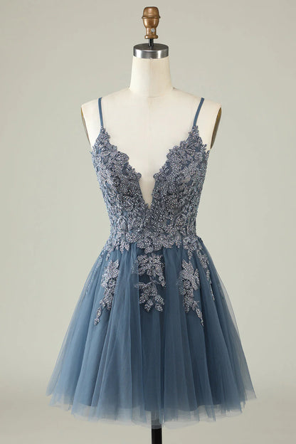 Model wearing an A-line spaghetti strap formal dress.