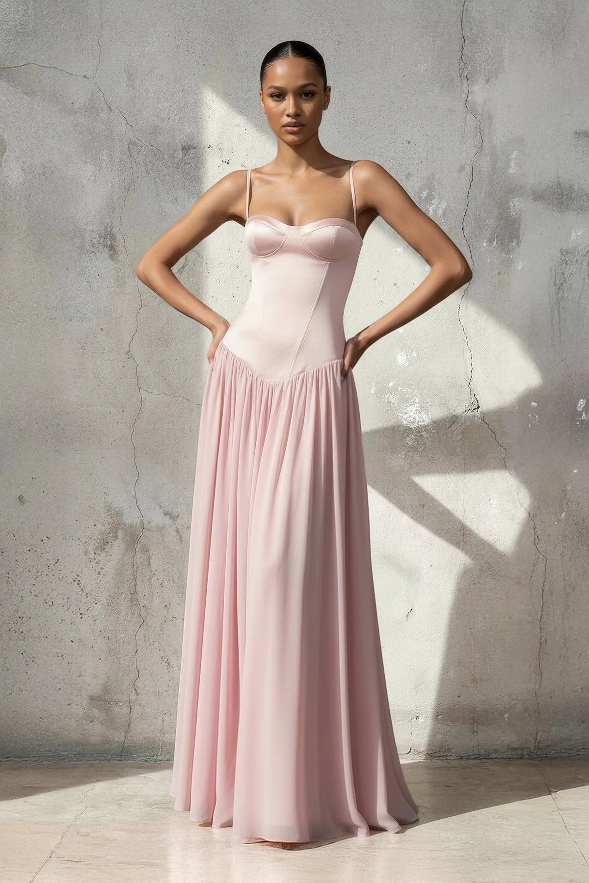 Elegant A-line chiffon gown with spaghetti straps and corset bodice.