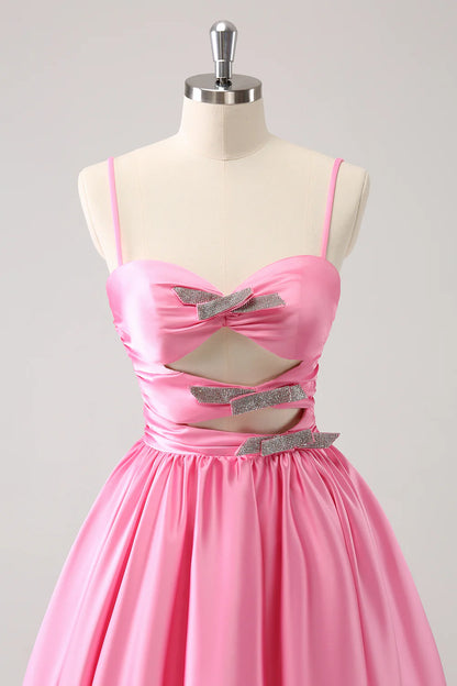 Model wearing a pink A-line homecoming dress, showcasing the keyhole detail.