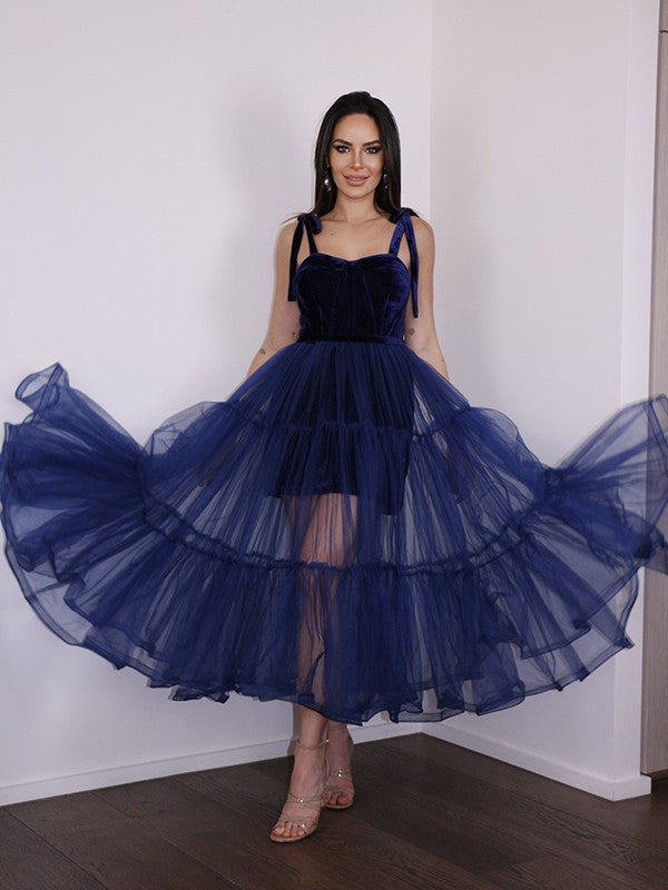 A-Line tea-length homecoming dress with spaghetti straps and ruffles, front view.