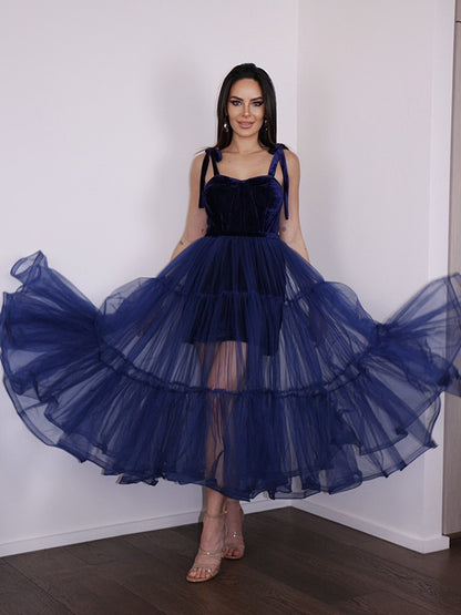 A-Line tea-length homecoming dress with spaghetti straps and ruffles, front view.