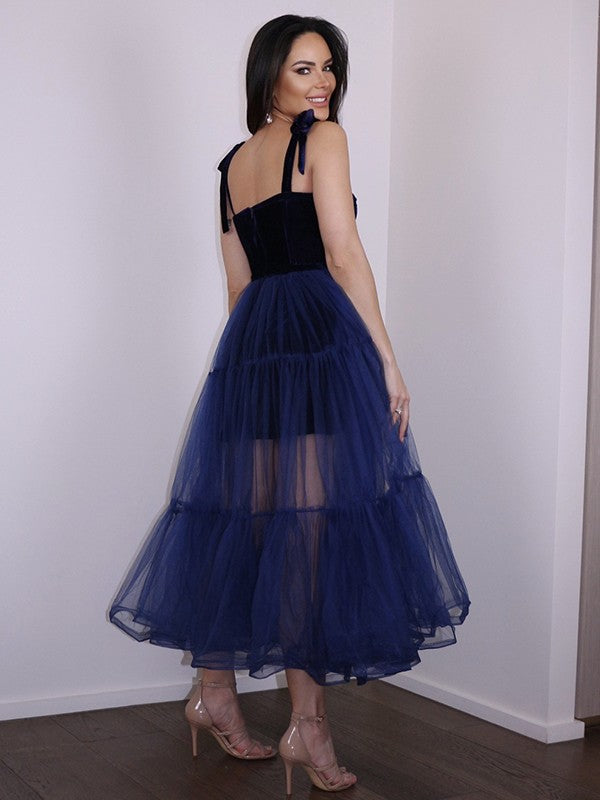 Back view of the A-Line tea-length homecoming dress with spaghetti straps.