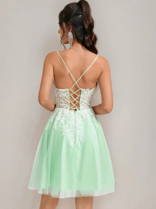 Side view of A-Line short homecoming dress with lace details.