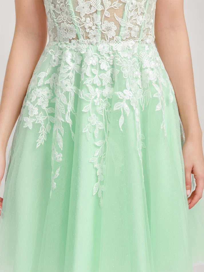 Back view of short homecoming dress showing lace appliques.