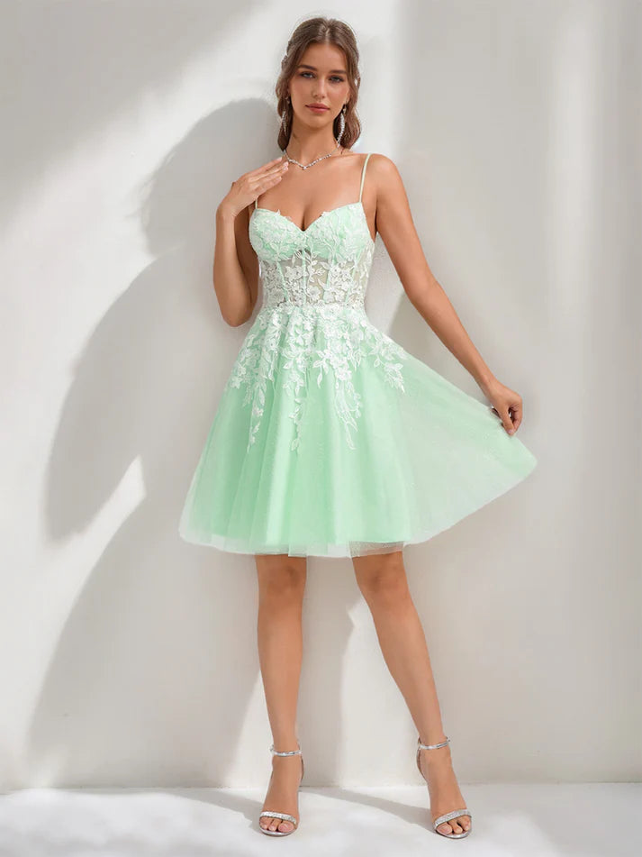 Close-up of lace appliques on the spaghetti strap homecoming dress.