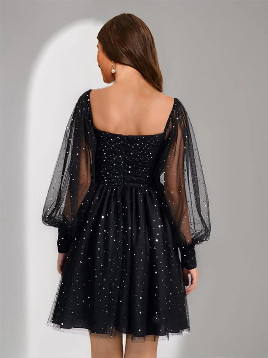 Side view of the A-Line short homecoming dress featuring long tulle sleeves.