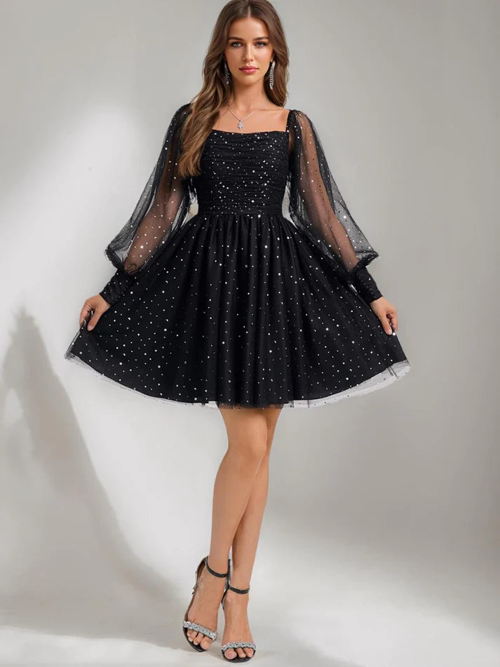 Close-up of sequin details on the tulle fabric of the homecoming dress.