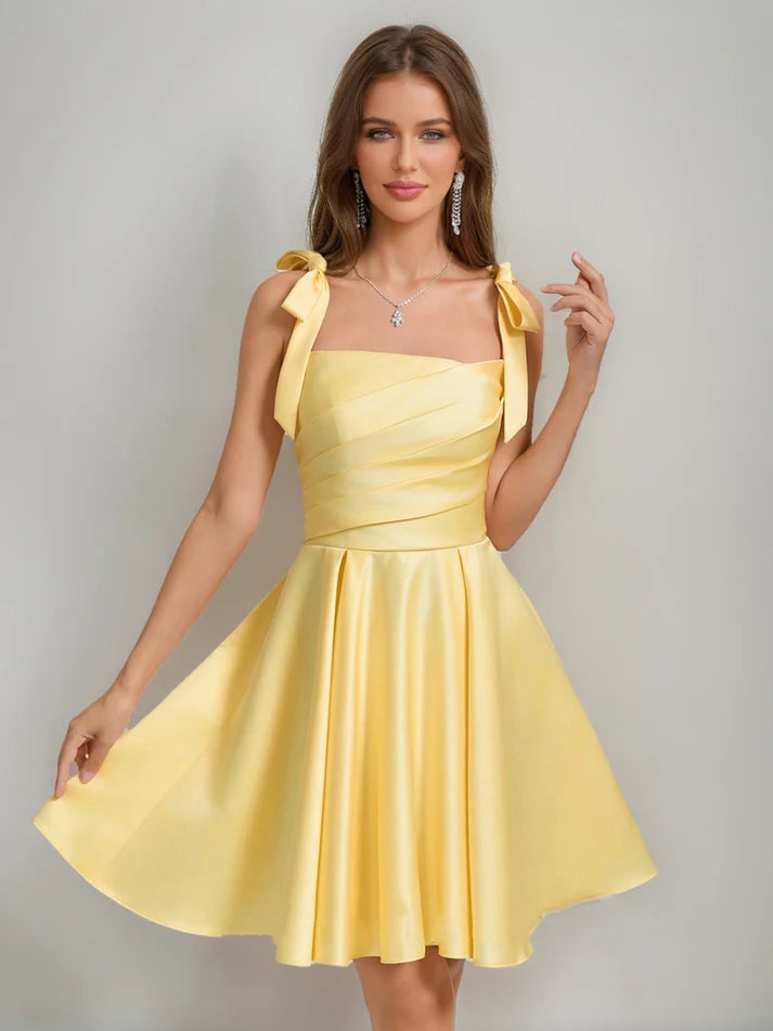 Side view of the A-Line square neck pleated mini homecoming dress.