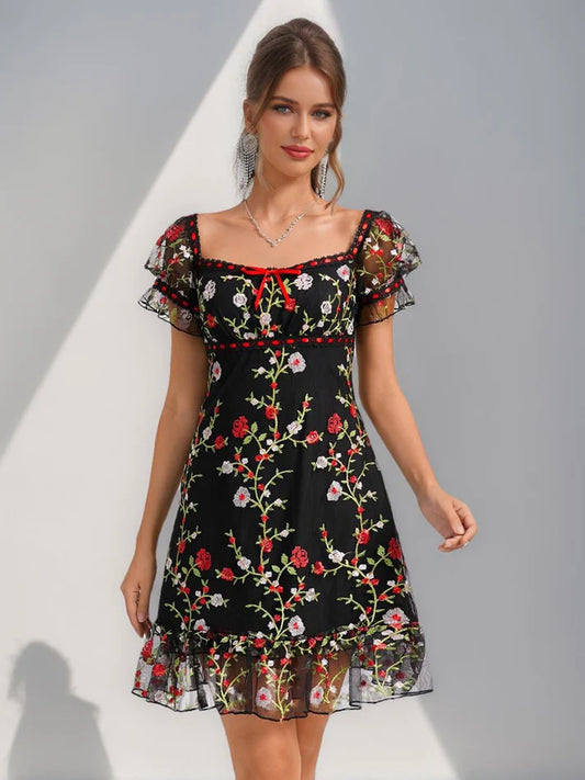 Elegant A-line short homecoming dress with square neckline, puff sleeves, ruffle details, and delicate embroidery.