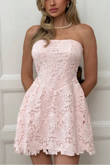 Side view of blush pink strapless A-line homecoming dress.