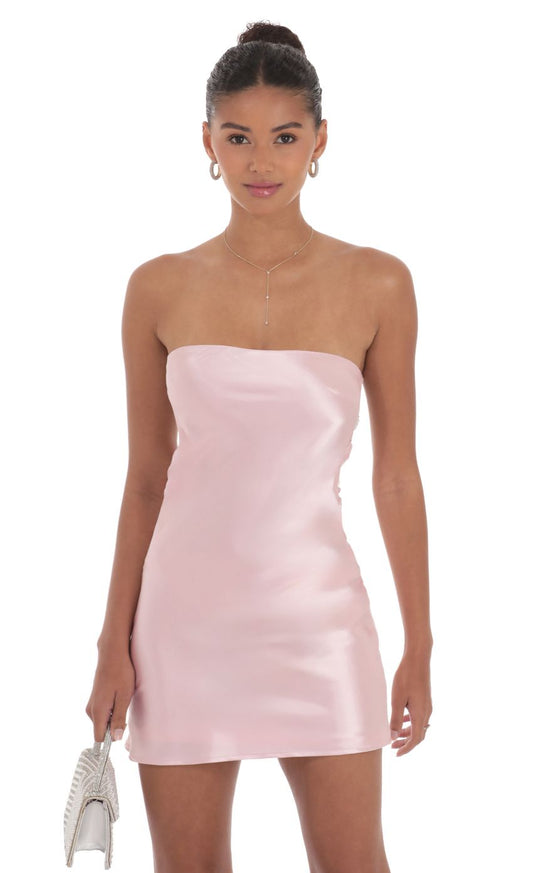 Back view of the blush pink strapless dress, highlighting the pearl detailing.