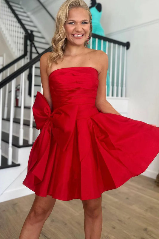 Red A-line strapless short homecoming dress with a bow.