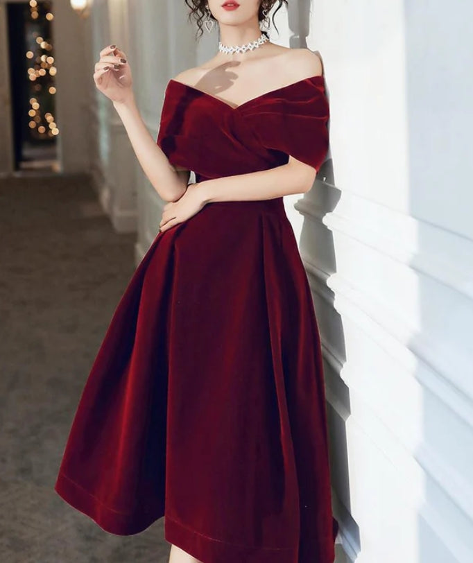 Back view of the wine red velvet A-line tea length dress.