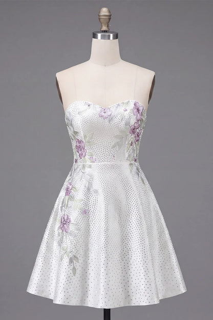 Side view of white strapless homecoming dress.