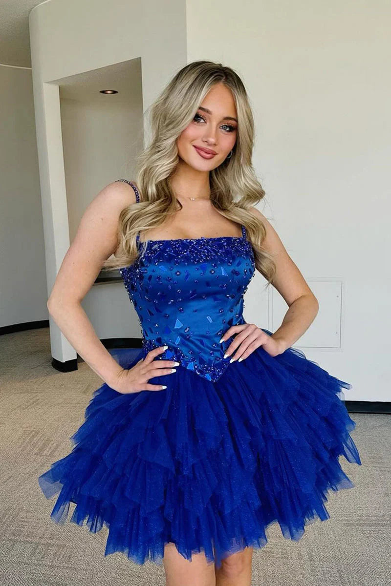 Royal blue A-line homecoming dress with ruffled tulle skirt and beaded bodice.