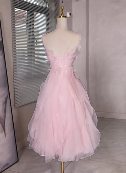 Close-up of the beaded bodice and low back detail of the pink tulle dress.