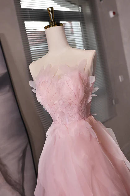 Side view of the pink tulle short dress, showcasing the flowing skirt.