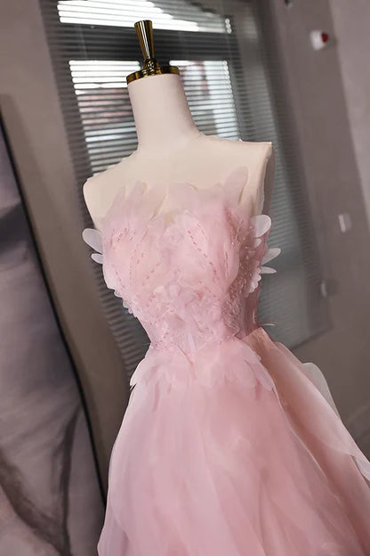 Side view of the pink tulle short dress, showcasing the flowing skirt.