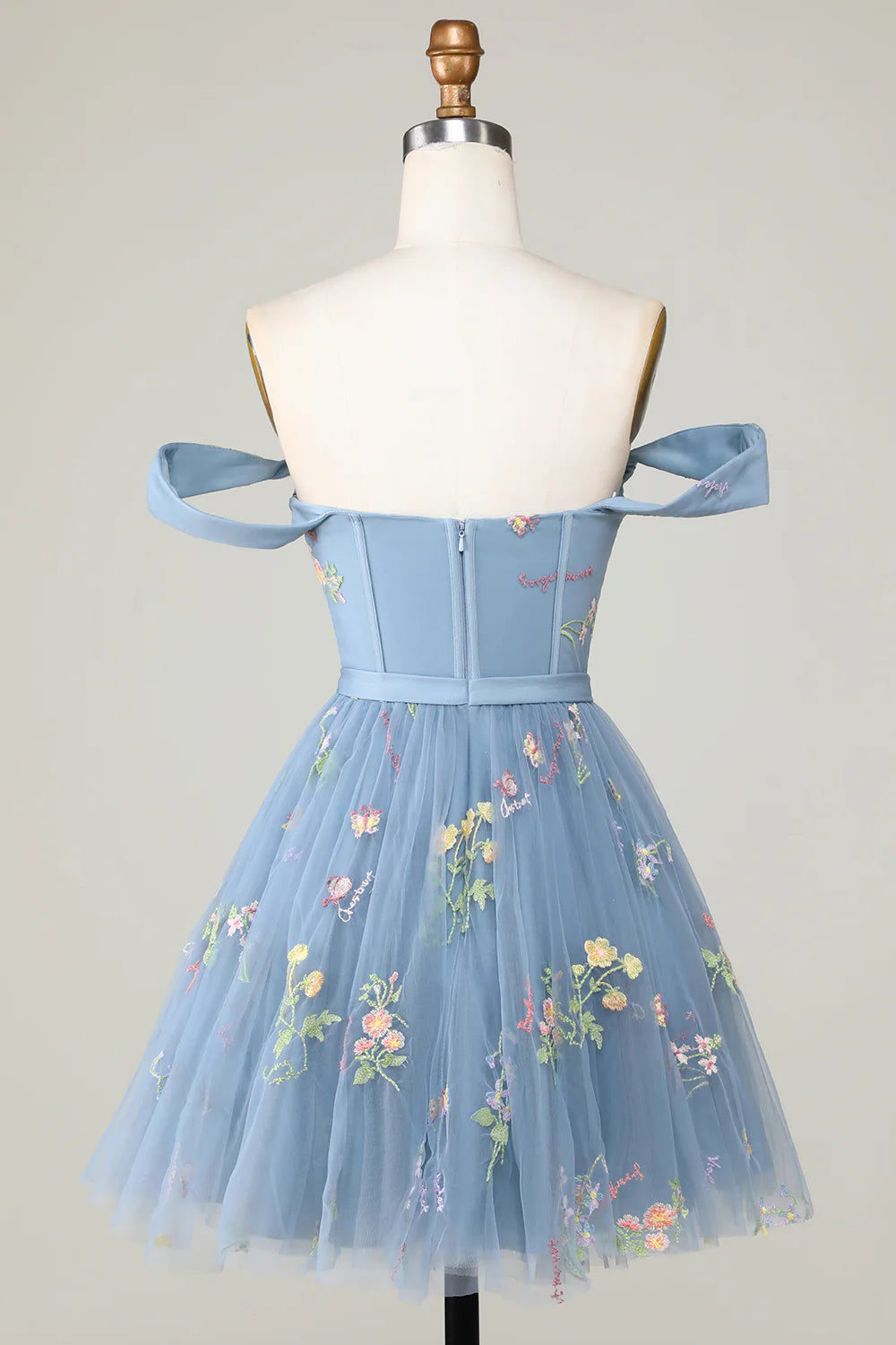 Back view of A-line embroidered knee-length dress.