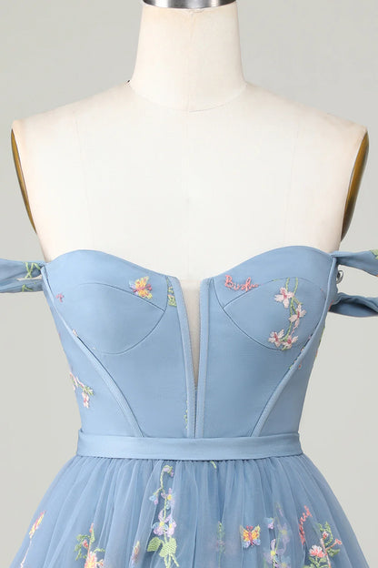 Close-up of embroidery detail on A-line dress.