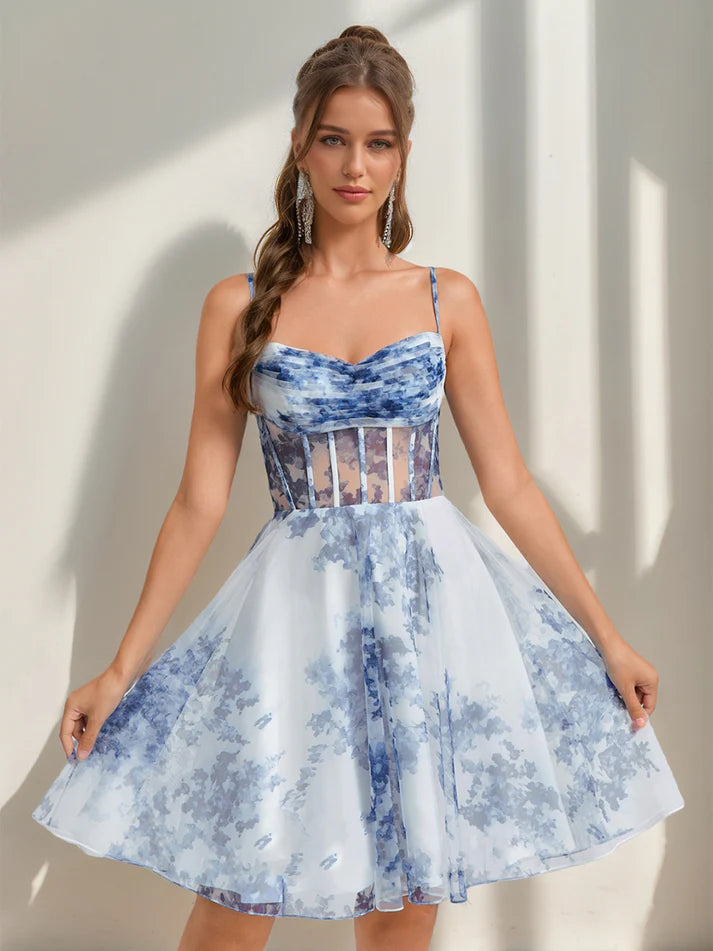Model wearing an A-line sweetheart floral mini homecoming dress, front view.