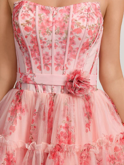 Close-up of the floral print and ruffled details on a sweetheart homecoming dress.