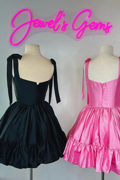 Close-up of the sweetheart neckline and luxurious satin fabric of the coral dress.