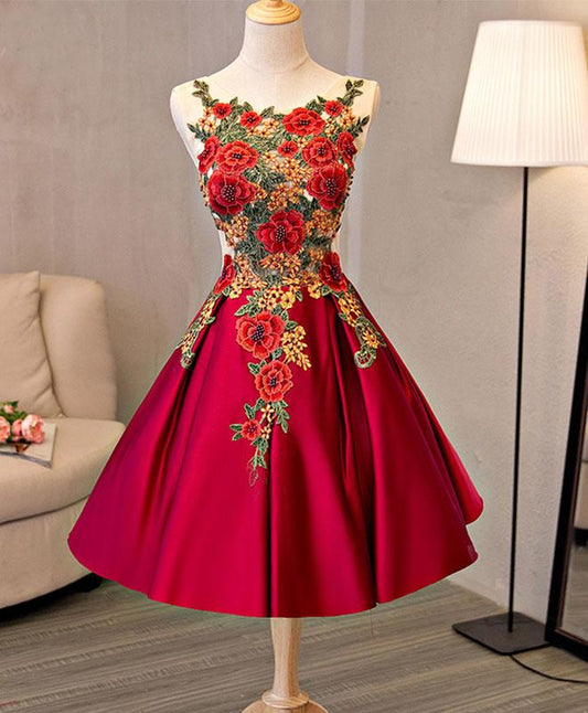 Red satin knee-length homecoming dress with delicate embroidery.