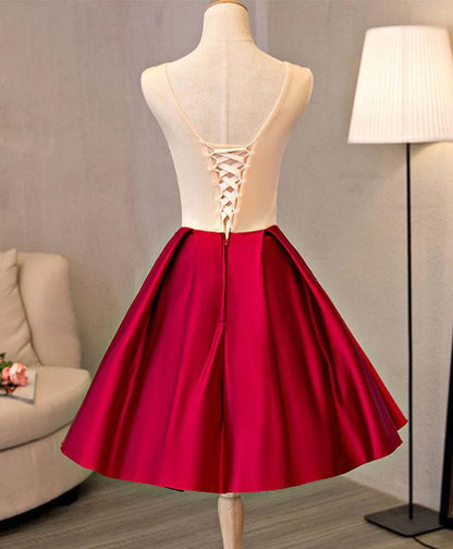 Side view of the red embroidered satin party dress.