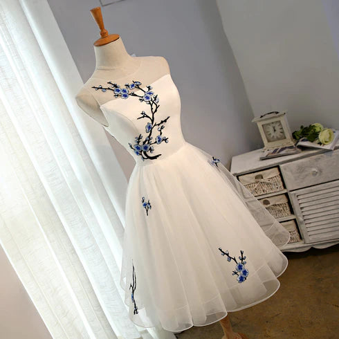 Back view of the white tulle knee-length dress.