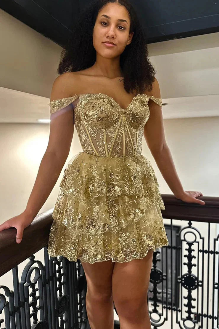 Close-up of the sequin and tiered details on the short homecoming dress.