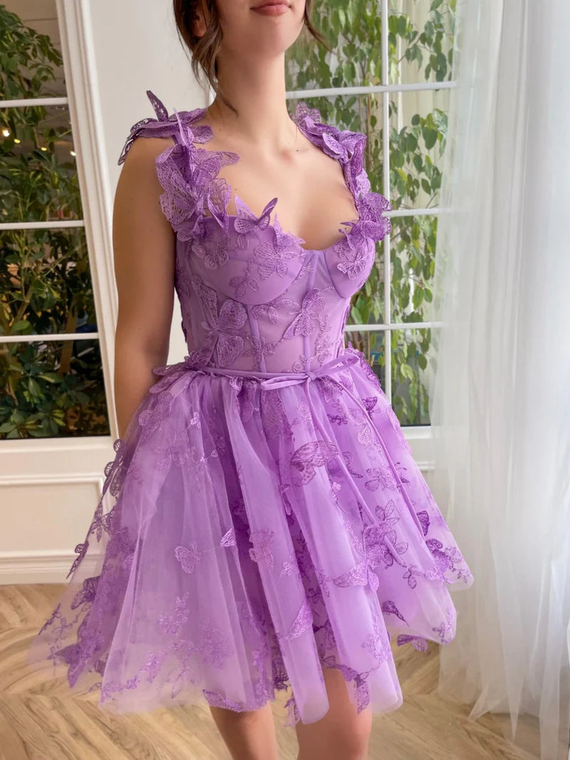 Close-up of bodice on lilac A-line short tulle dress with 3D butterflies.