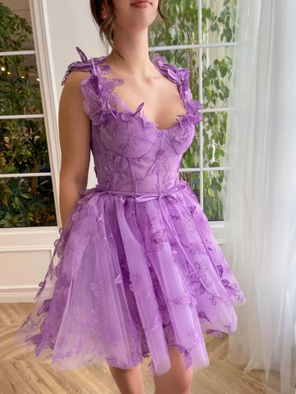 Close-up of bodice on lilac A-line short tulle dress with 3D butterflies.