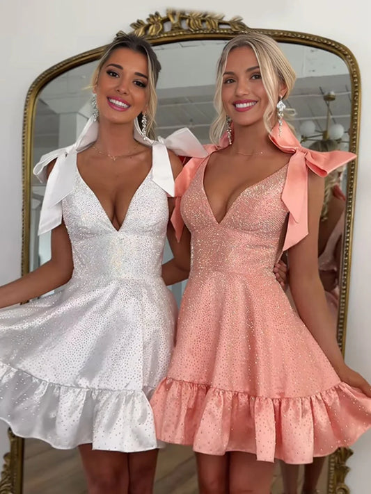 Elegant A-line V-neck homecoming dress with beading and a bow.