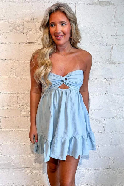 Close-up of the pleated satin fabric on a short dress.