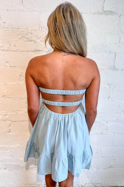 Model wearing an A-line V-neck empire-waist short homecoming dress.