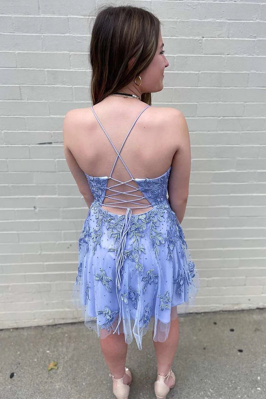 Back view of lavender short homecoming dress showing lace-up corset detail and tulle skirt.