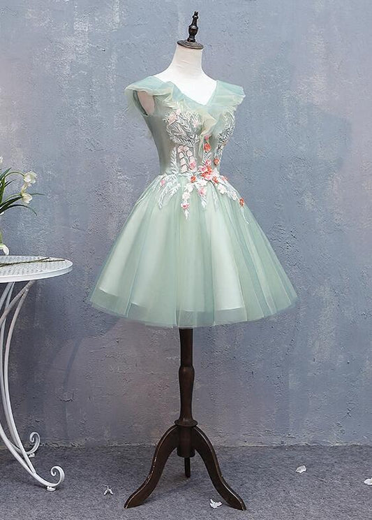 Short tulle V-neck dress with floral lace appliques.