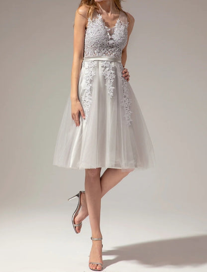 Back view of the silver V-neck lace short dress.