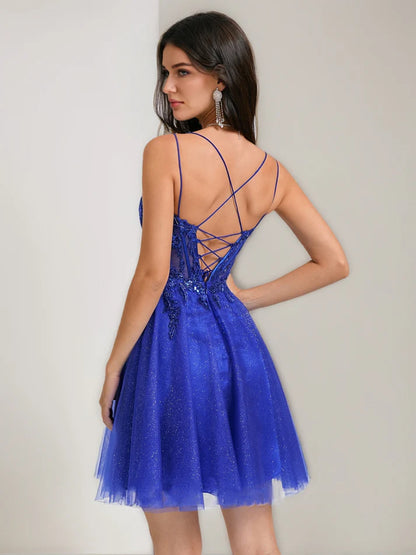 Side view of a short A-line tulle dress featuring a V-neck and delicate strap details.