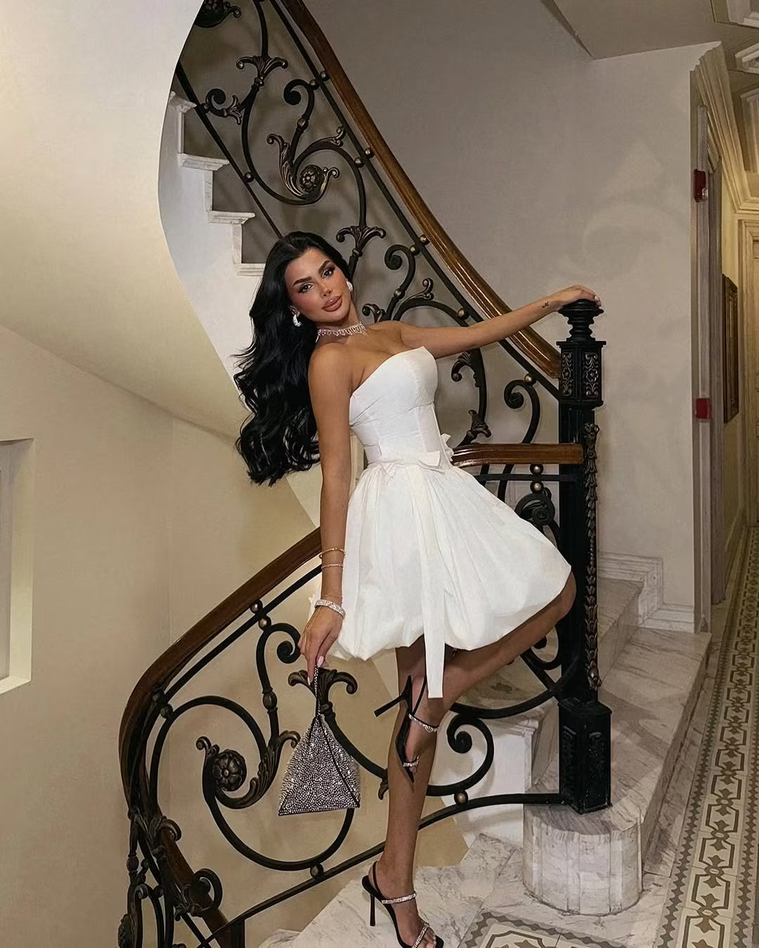 Back view of the white strapless corset bubble mini dress.