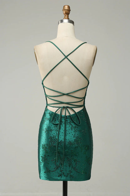 Model wearing a dark green beaded bodycon mini dress, side view, showing intricate beading.