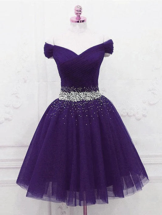 Model wearing a purple off-shoulder sweetheart knee-length homecoming dress with beading.