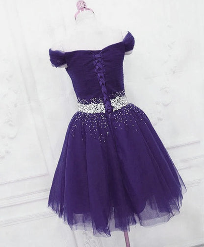 Side view of the purple off-shoulder beaded tulle dress.