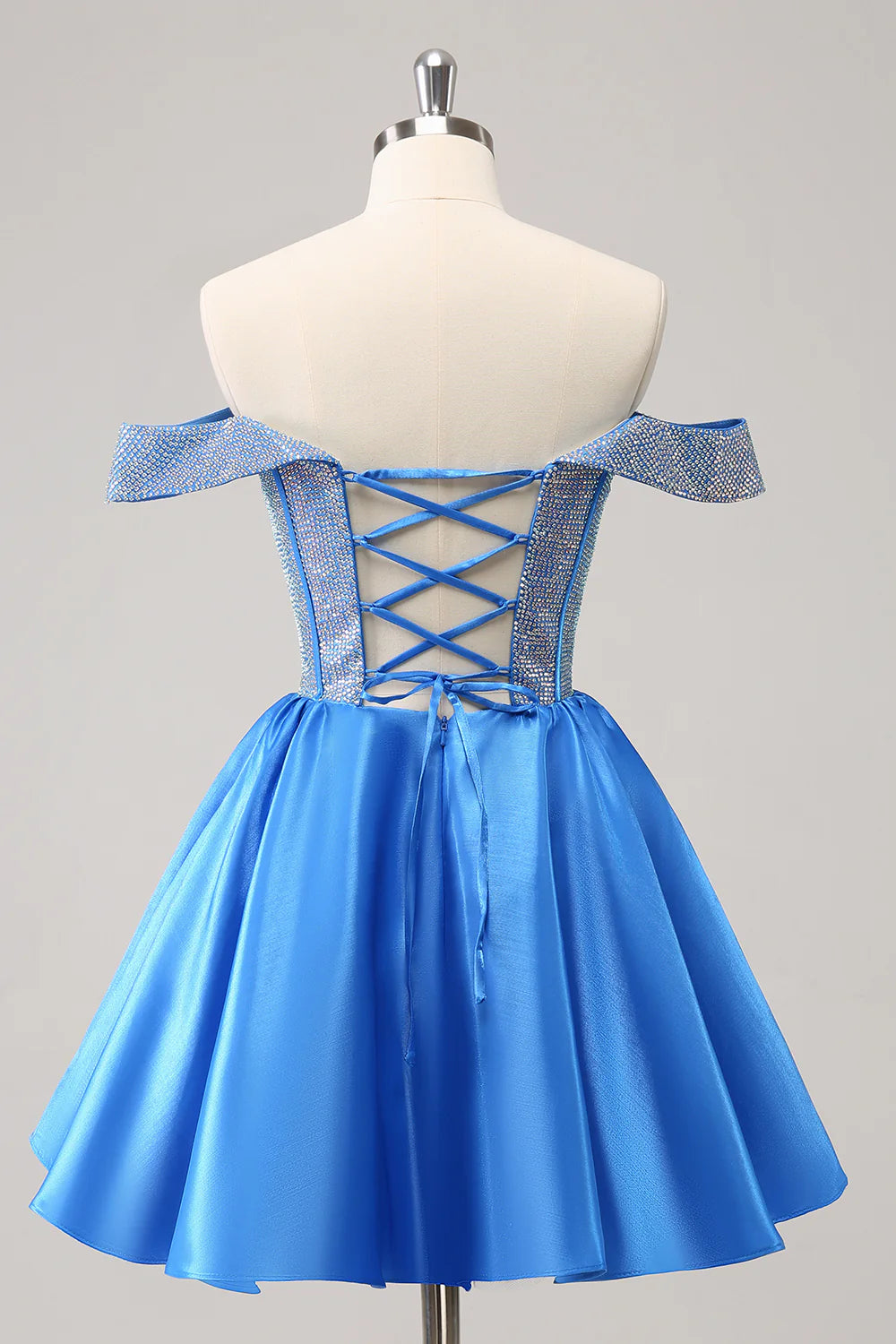 Side view of a blue A-line off-shoulder satin formal dress.