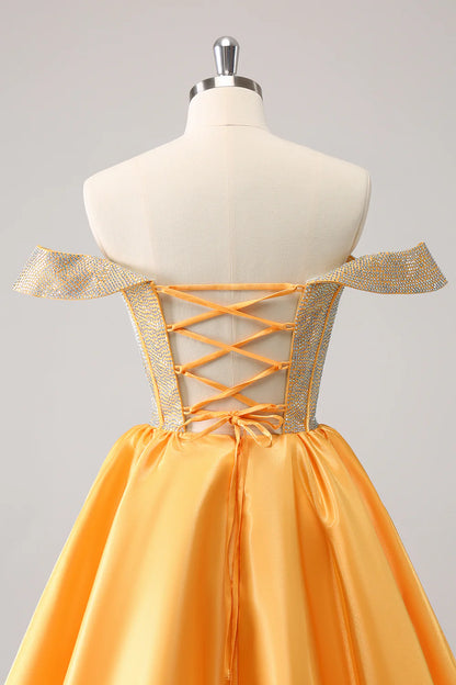 Back view of yellow A-line off-shoulder dress showcasing lace-up detail.