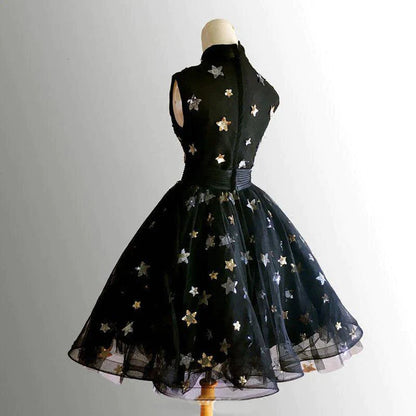 Sophisticated black short prom dress with high neckline.