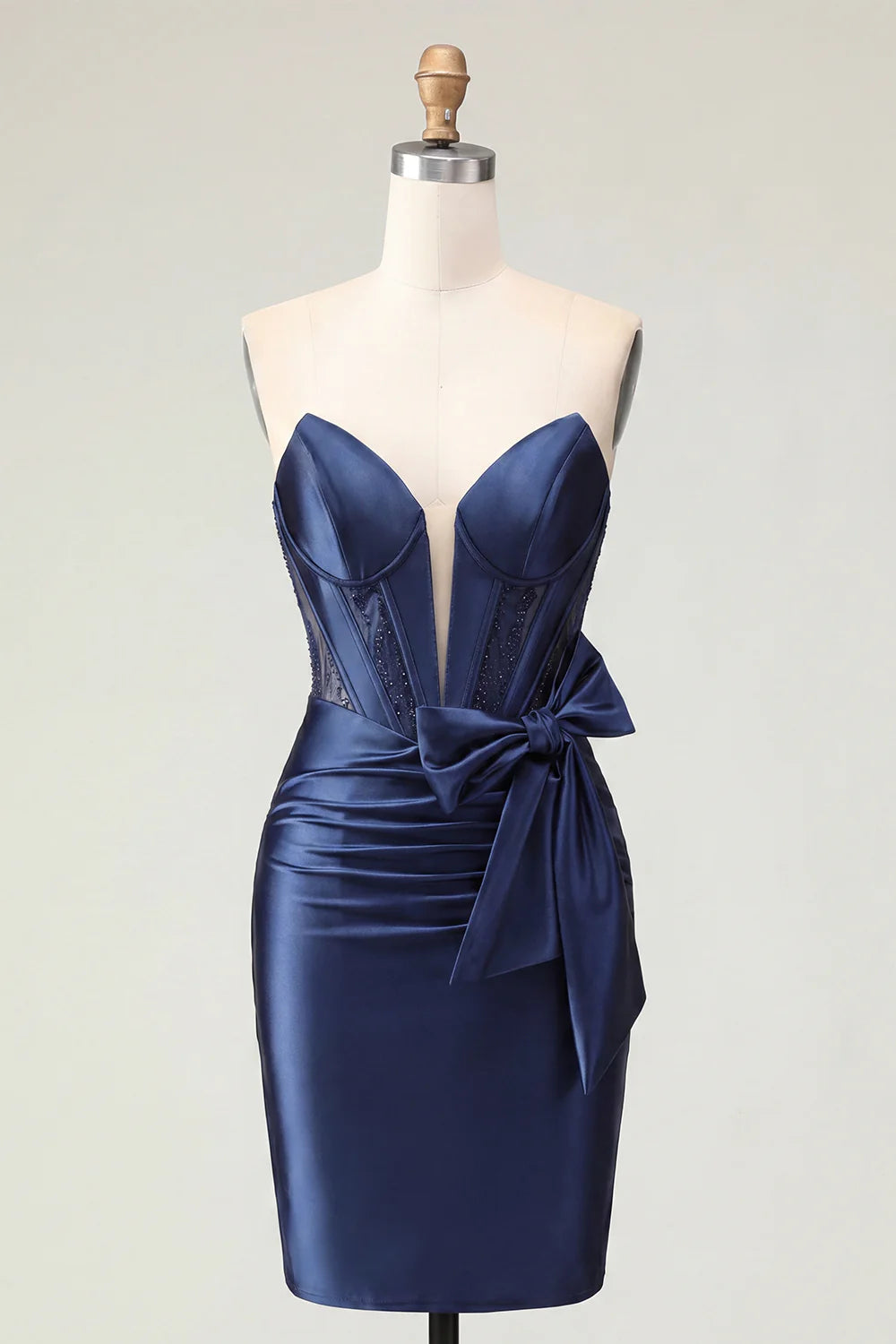 Navy blue strapless dress on a model, showcasing the luxurious satin fabric.